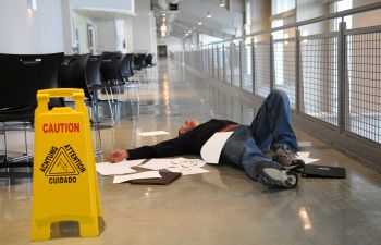 an injured man on the floor after slip and fall