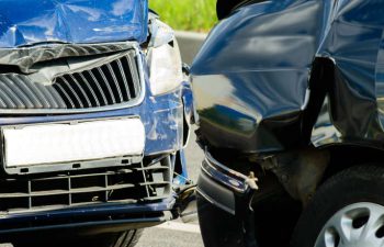 two wrecked cars after collision