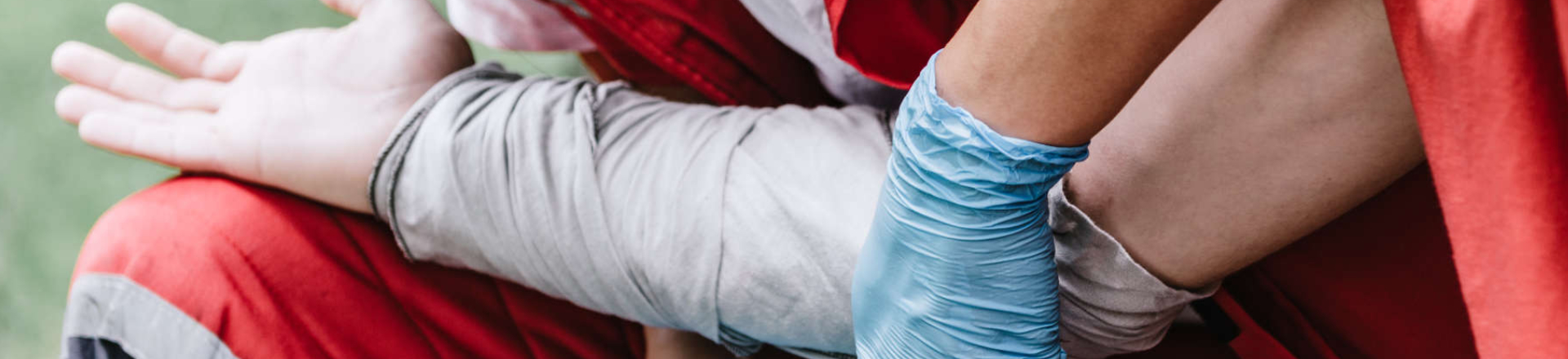 paramedics wrapping a wounded arm of an electical injury victim