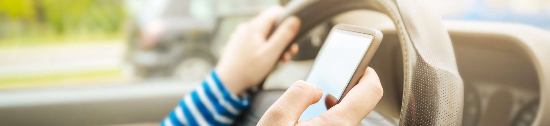 a person texting while driving