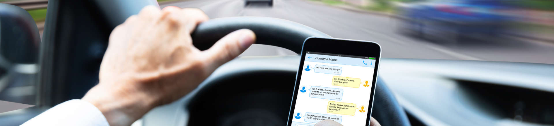 a person texting while driving