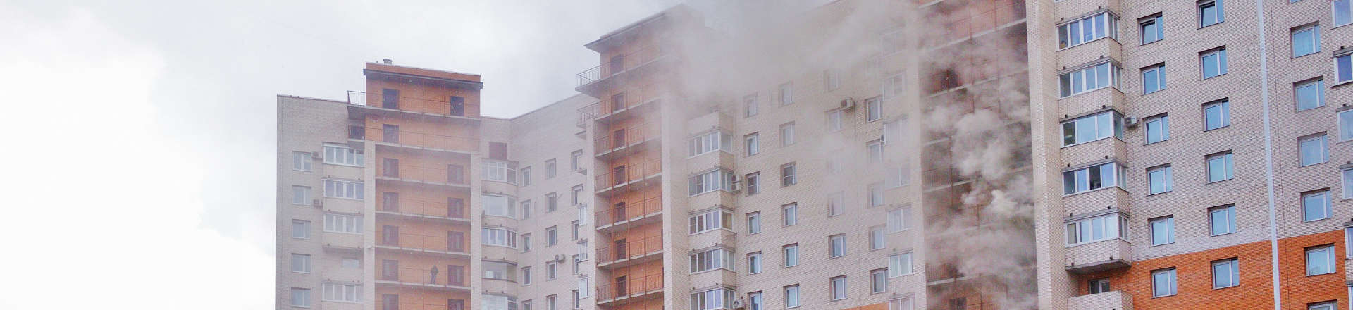 smoke coming out of an apartment building