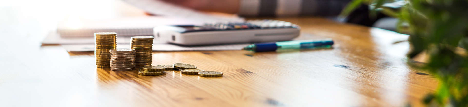 coins and a phone on a desk