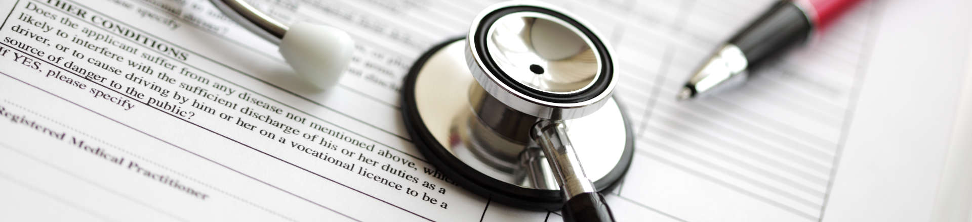 a stethoscope and a medical form