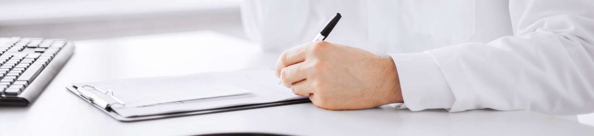 a doctor filling in papers
