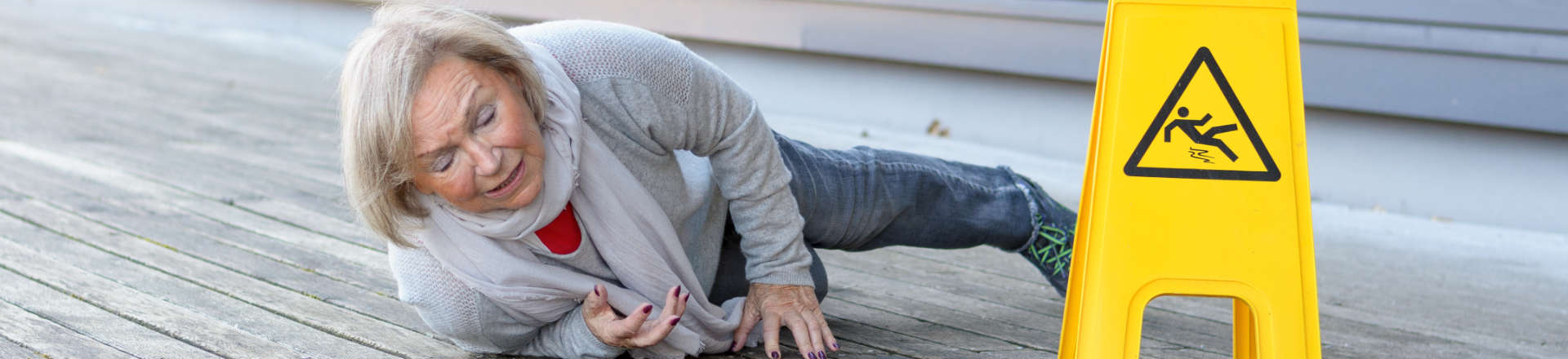 a woman on the wooden deck after slip and fall