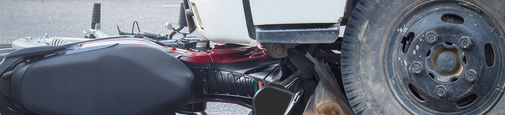 crashed motorcycle after underride truck accident
