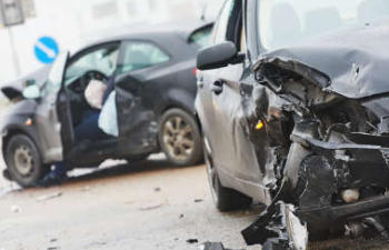 two wrecked cars after collision