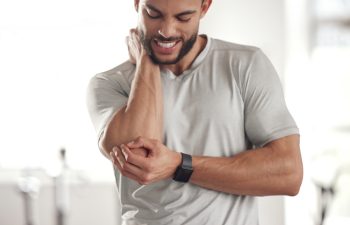 Fitness, stress and man with elbow pain for in gym for training, discomfort and joint problem. Frustrated, athlete and person with workout emergency for bursitis, inflammation and injury in exercise